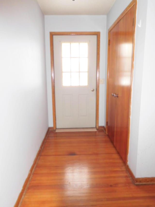 doorway to outside with light wood-type flooring