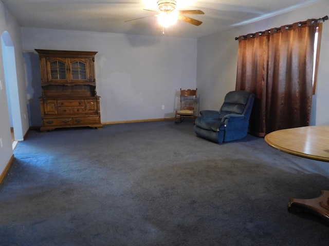 unfurnished room featuring ceiling fan and carpet flooring