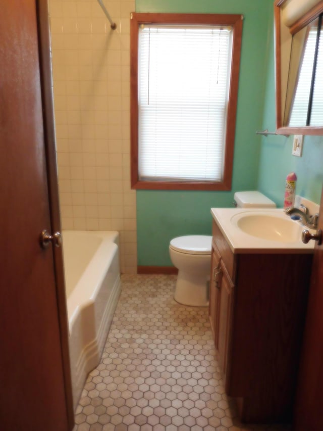 full bathroom featuring vanity,  shower combination, and toilet