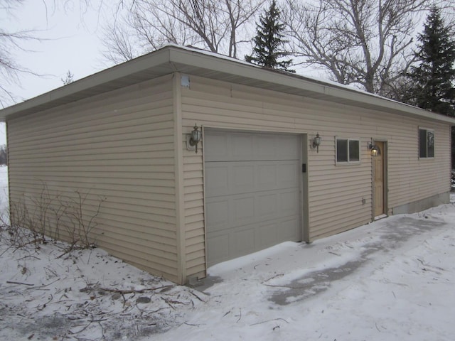 view of snow covered garage