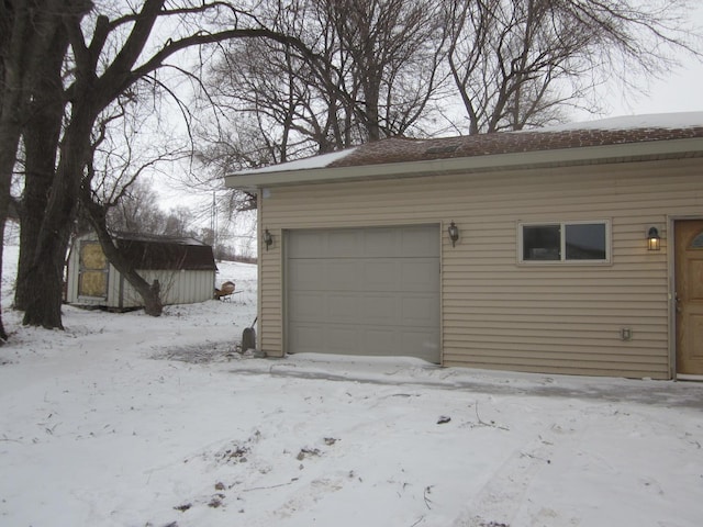 view of snow covered garage