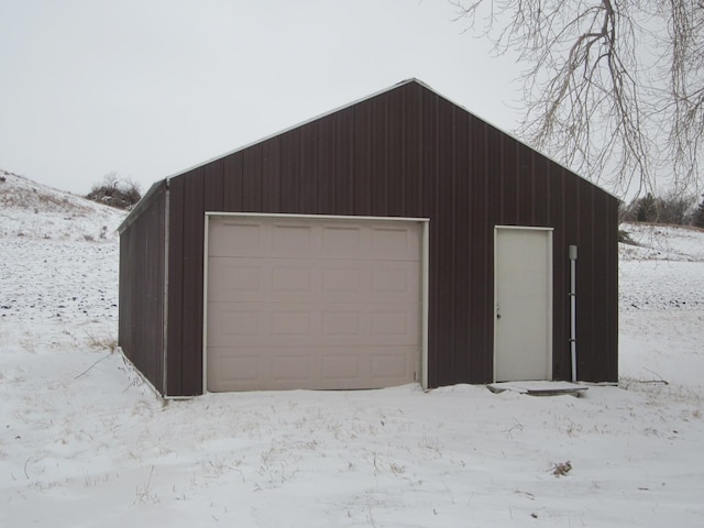 view of snow covered garage