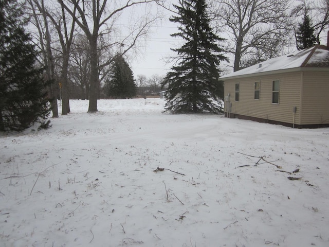 view of yard covered in snow