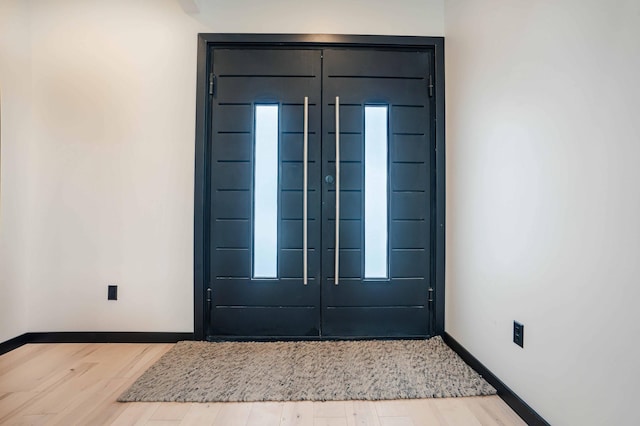 foyer with light wood-type flooring