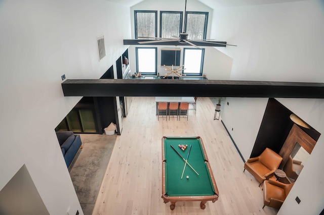 interior space with ceiling fan, hardwood / wood-style floors, vaulted ceiling, and billiards