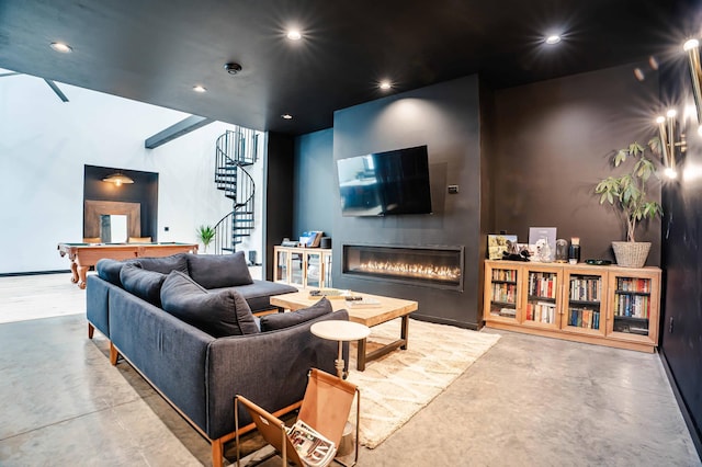 living room with pool table and concrete floors