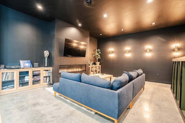 home theater with concrete flooring