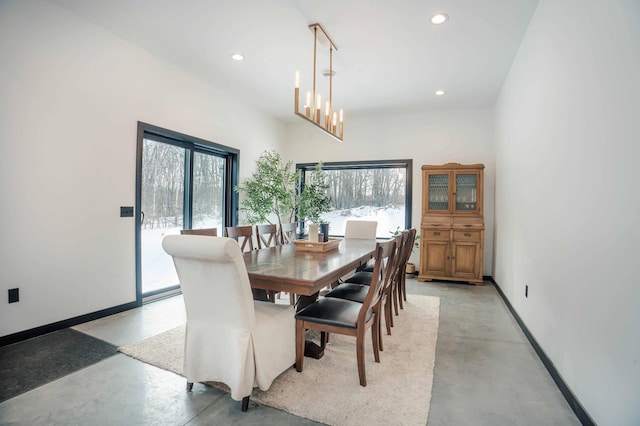 dining area with a notable chandelier and a wealth of natural light