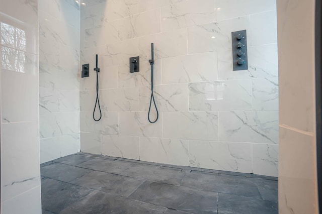 bathroom with tiled shower