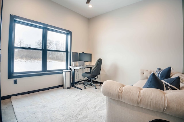 home office with carpet and ceiling fan