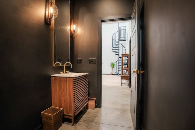 bathroom with vanity and concrete flooring