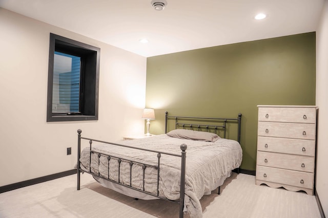 bedroom featuring light colored carpet