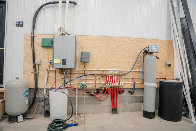 utility room featuring tankless water heater