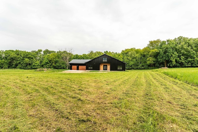 34520 County Highway 14, Richville, MN 56576 - view of grassy yard with an outbuilding, a garage, and a view of rural / pastoral area