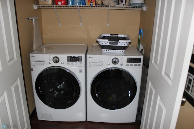 clothes washing area with washing machine and clothes dryer