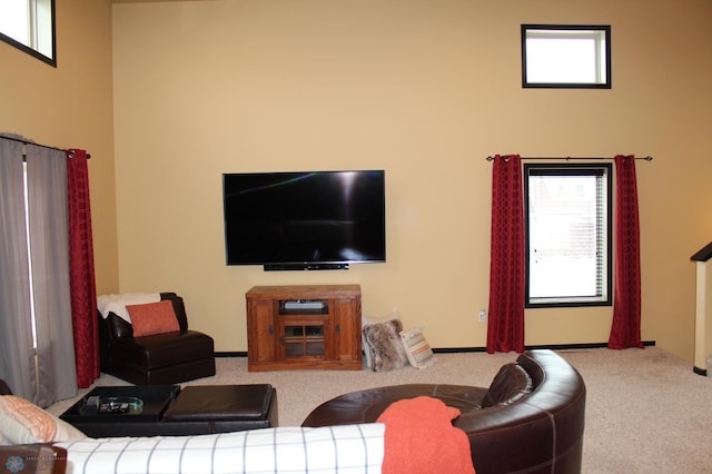 living room featuring light carpet and a healthy amount of sunlight