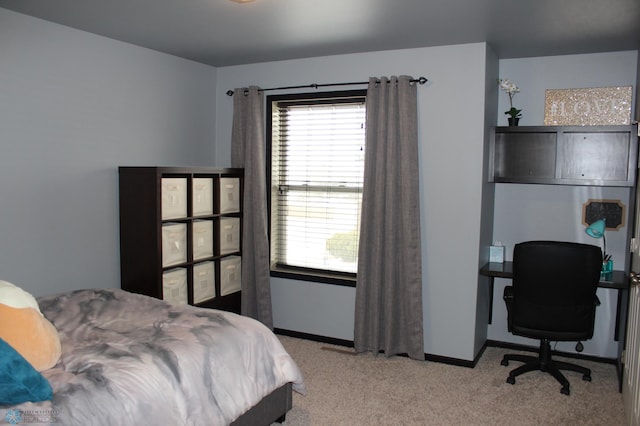 bedroom with light colored carpet