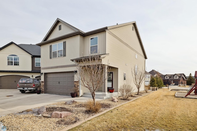 craftsman inspired home featuring an attached garage, stone siding, and driveway