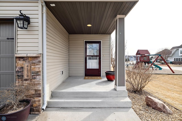 entrance to property featuring stone siding