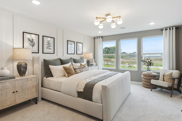 bedroom featuring light carpet and multiple windows