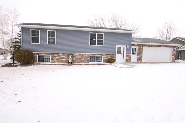 split level home featuring a garage