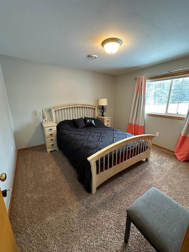 carpeted bedroom with a textured ceiling