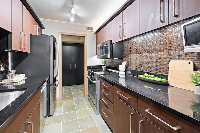 kitchen with tasteful backsplash, ornamental molding, appliances with stainless steel finishes, and dark stone countertops