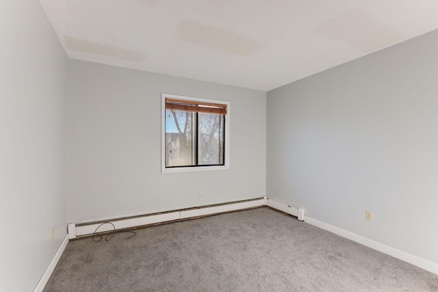 carpeted empty room with a baseboard radiator