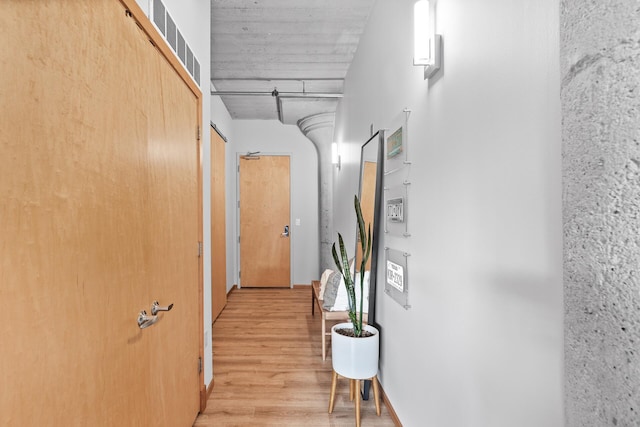 hallway with wood-type flooring