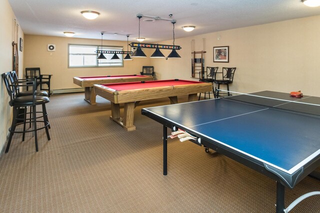 playroom with carpet floors, a baseboard radiator, and billiards