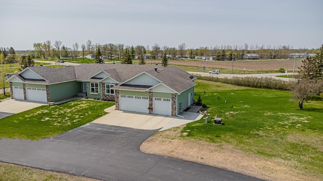 view of front facade featuring a garage and a front yard