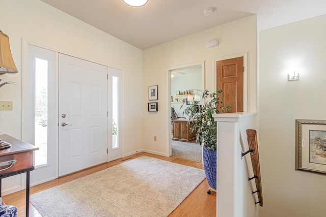 entryway with light hardwood / wood-style flooring