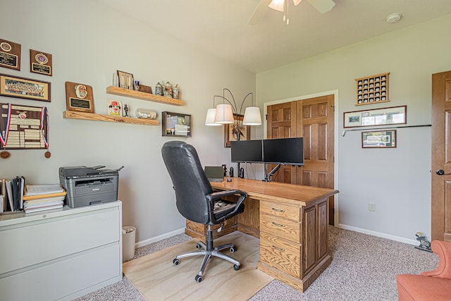 carpeted home office with ceiling fan