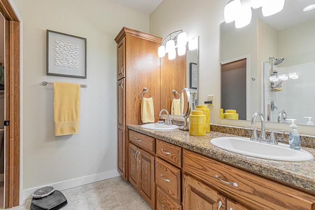 bathroom featuring vanity, tile patterned floors, and a shower