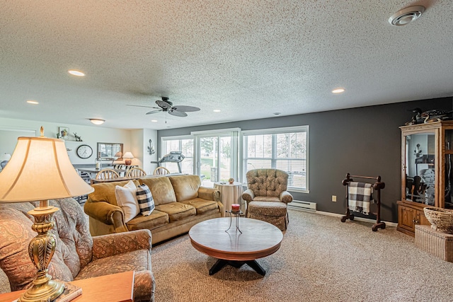 carpeted living room featuring a baseboard radiator, ceiling fan, and a textured ceiling