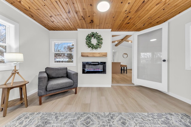 living area featuring lofted ceiling, wood ceiling, and hardwood / wood-style flooring