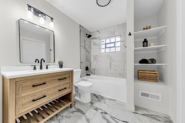 full bathroom featuring tiled shower / bath, vanity, and toilet