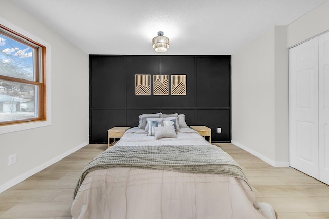 bedroom with light hardwood / wood-style flooring