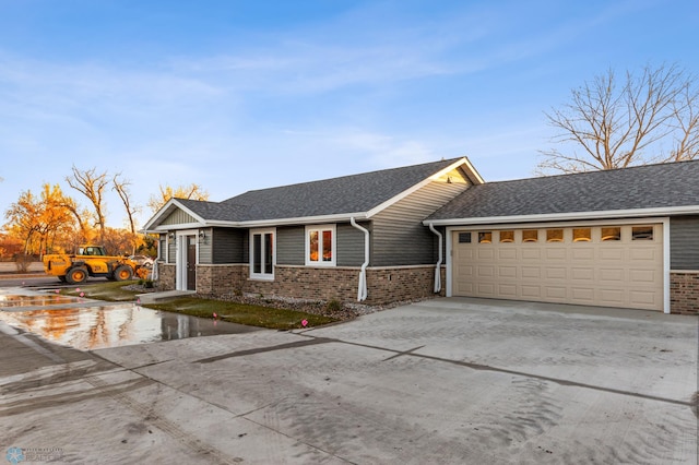 single story home featuring a garage