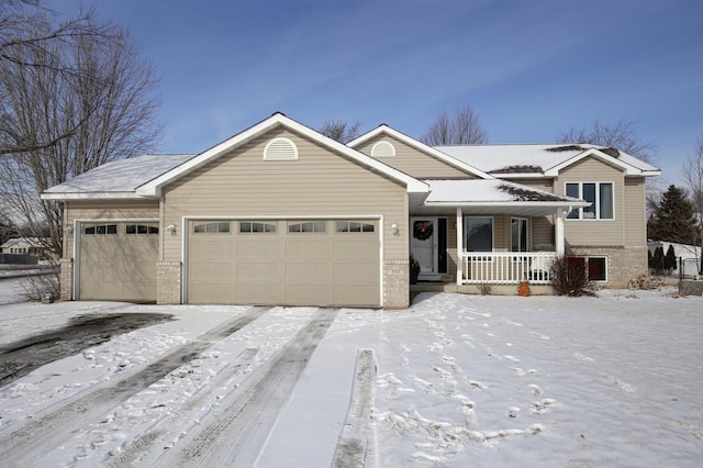 view of front of house with a garage and covered porch