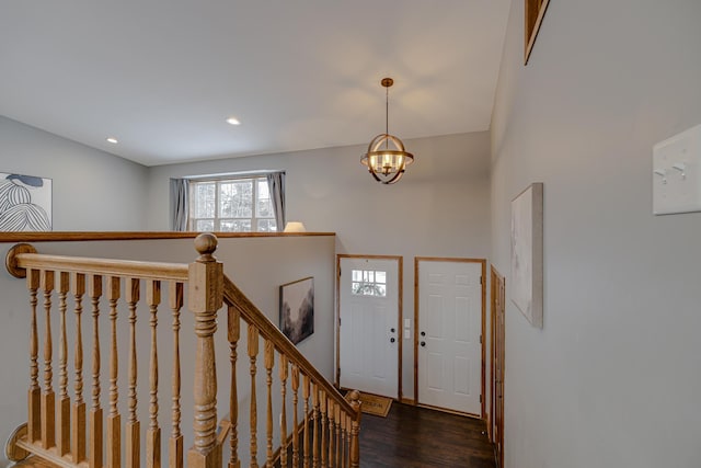 foyer featuring a notable chandelier and dark hardwood / wood-style floors