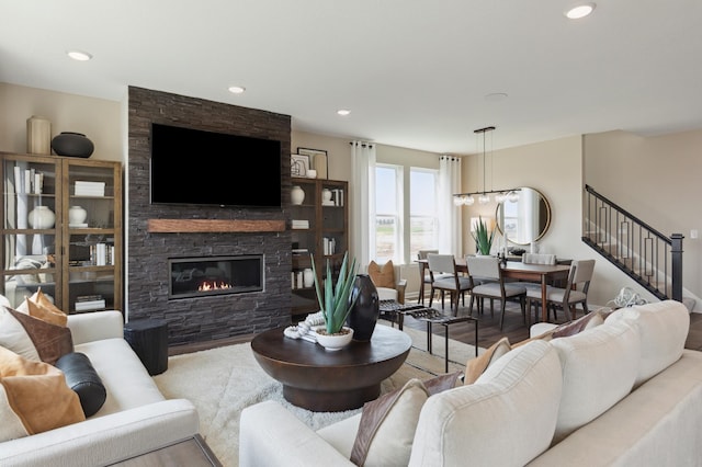 living room with light hardwood / wood-style flooring and a fireplace