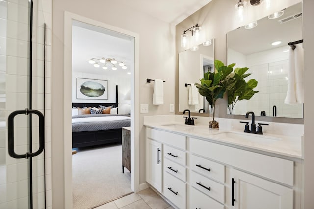 bathroom with tile patterned flooring and vanity