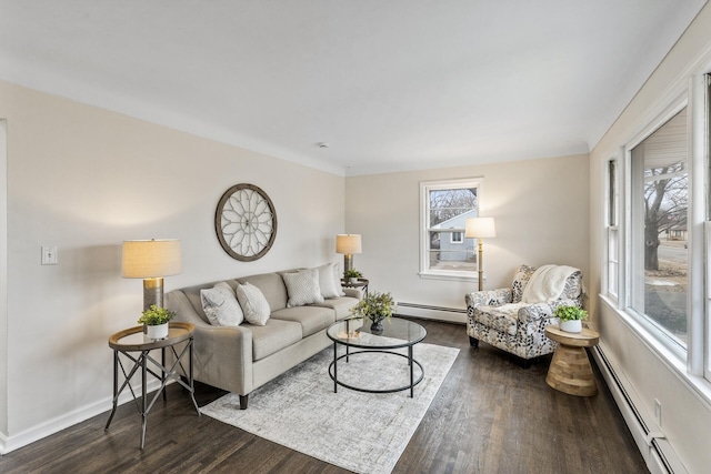 living room with dark hardwood / wood-style floors and baseboard heating