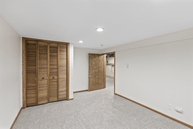 unfurnished bedroom with a closet and carpet