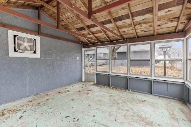 unfurnished sunroom featuring vaulted ceiling