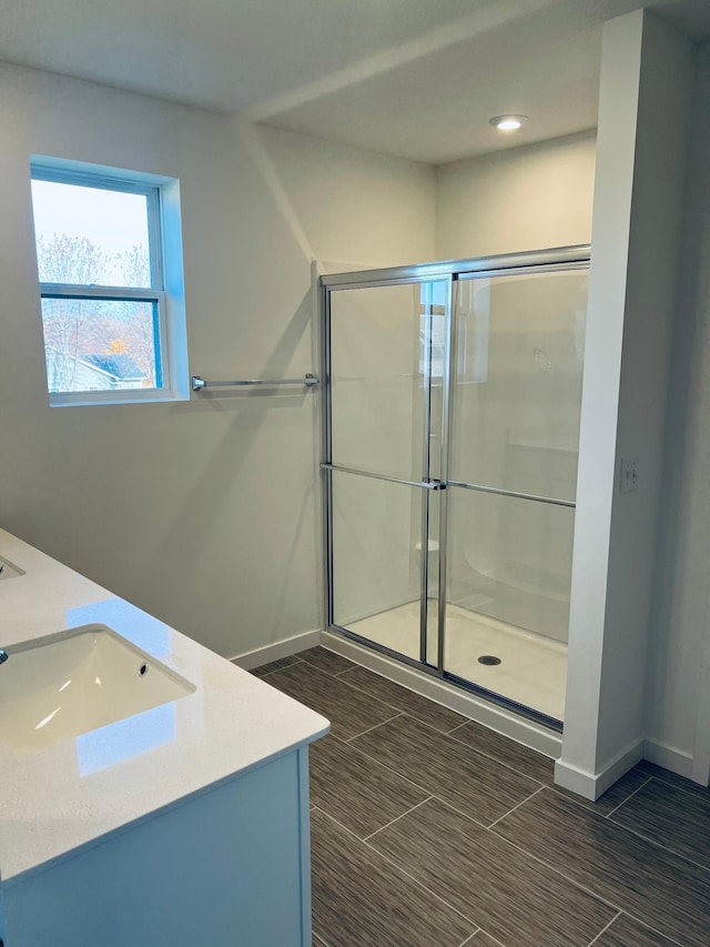 bathroom with vanity and an enclosed shower