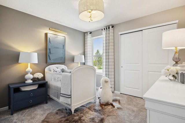 bedroom with dark carpet and a closet