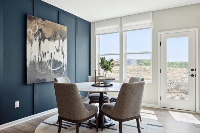 dining space with light wood-type flooring