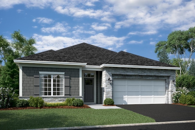 view of front of home featuring a garage and a front lawn